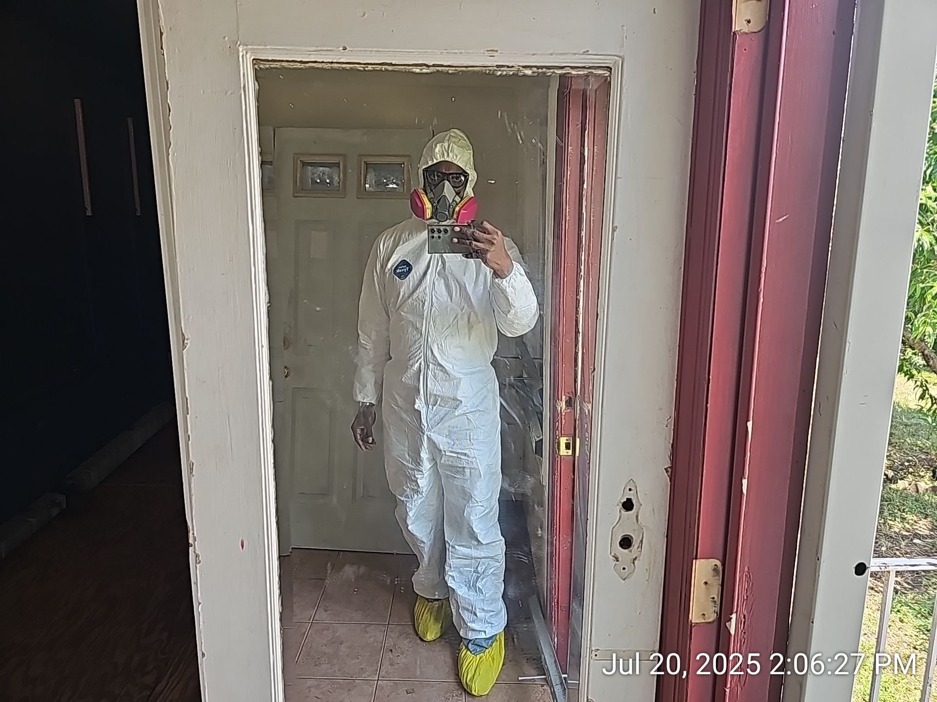 On-site REO property assessment in full protective gear